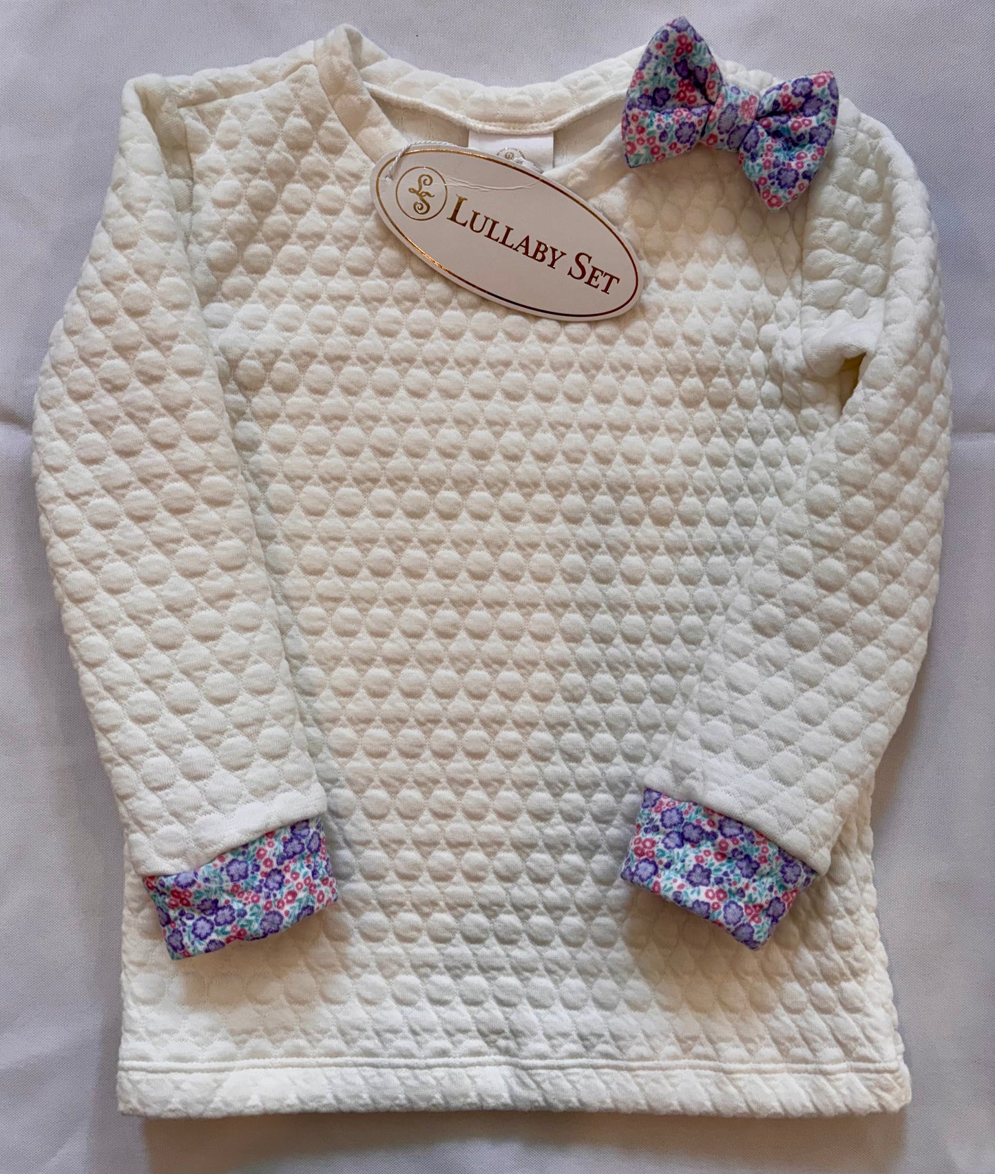 Quilted Pullover with Floral Bow